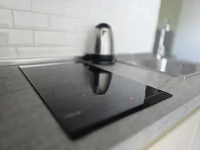 a kitchen counter with a sink and a faucet at Lagoon Loft Studio T3-627 in Chalong