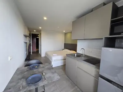 a small kitchen with a bed in a room at Palm Bay Studio T3 -532 in Phuket Town