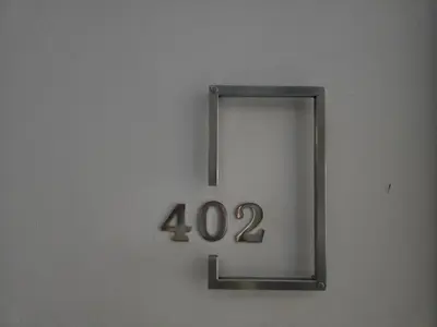 a clock on a wall with the number fortytwo at 1 BR Condo in good location NV402 in Phuket Town