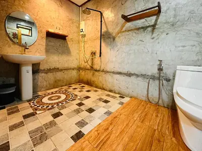 a bathroom with a sink and a toilet at Bangalow Coconut corner in Ban Laem Sai
