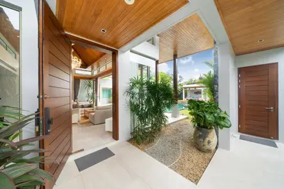 an internal entrance to a house with plants at Luxury 4BR Pool Villa Botanica Bangtao Beach in Ban Thalat Choeng Thale