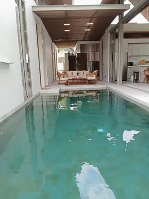 a swimming pool with turquoise water in a house at Luxury Design 3 Bedroom Villa AB2 in Phuket Town