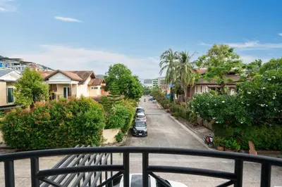 a view from a balcony of a street with houses at At Bangla Patong Pool Moon villa in Patong Beach