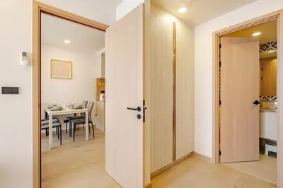 a door leading into a dining room with a table at The Ozone Condominium 513 One-Bedroom Apartment in Laguna Phuket