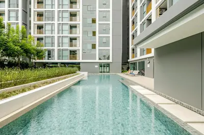 a swimming pool in the middle of a building at The Ozone Condominium 513 One-Bedroom Apartment in Laguna Phuket
