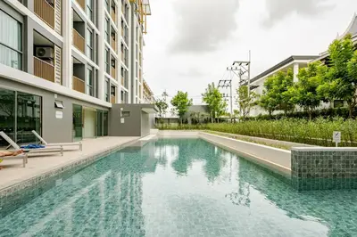 a swimming pool in the middle of a building at The Ozone Condominium 513 One-Bedroom Apartment in Laguna Phuket