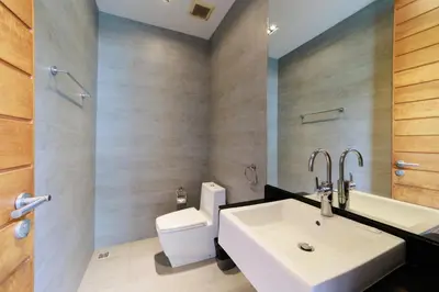 a bathroom with a sink and a toilet at Villa Coco - Classy Modern 2 Bedroom Pool Villa in Ban Saiyuan (1)