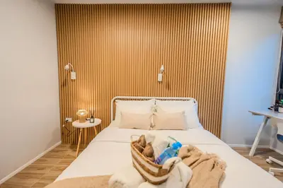 a bedroom with a bed with towels on it at ZcapeX2 94-17 by SilqStay in Bang Tao Beach
