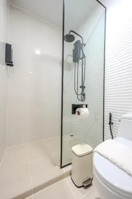 a bathroom with a shower and a toilet at ZcapeX2 94-17 by SilqStay in Bang Tao Beach