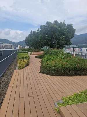 a wooden walkway on top of a building at The Deck Patong Pool View in Patong Beach
