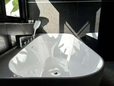 a white sink with a faucet in a bathroom at Villa Lola - Modern 3 Bedrooms Villa with Pool in Ban Saiyuan (1)