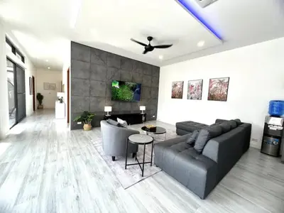 a living room with a couch and a table at Villa Lola - Modern 3 Bedrooms Villa with Pool in Ban Saiyuan (1)