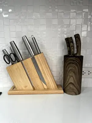 a wooden cutting board with knives and scissors on a counter at Villa Lola - Modern 3 Bedrooms Villa with Pool in Ban Saiyuan (1)