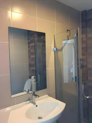 a bathroom with a sink and a shower with a mirror at GO INN Krabi Ao Nang Beach - โกอินน์ อ่าวนาง in Ban Khlong Haeng