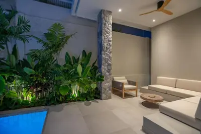 a living room with a swimming pool at Nomad Villa - Elegant 3 Bedrooms Balinese Pool in Rawai Beach