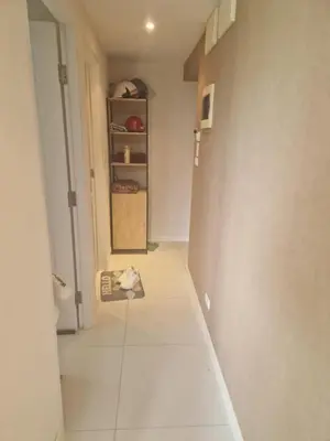 a hallway with a room with a door and a shelf at Christian Apartament in Kata Beach