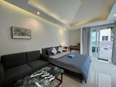 a living room with a bed and a couch at 3bedrooms pool Villa in Kamala in Kamala Beach