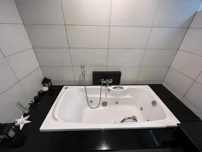 a bath tub in a bathroom with a star on the floor at 3bedrooms pool Villa in Kamala in Kamala Beach