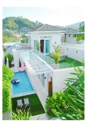 a house with a swimming pool in front of it at 3bedrooms pool Villa in Kamala in Kamala Beach