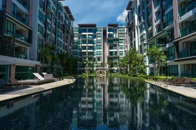 a swimming pool in the middle of a city with buildings at New 1 Bdr Royal Lee Nayang beach in Ban Bo Han