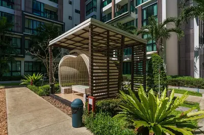 a small wooden structure in front of a building at New 1 Bdr Royal Lee Nayang beach in Ban Bo Han