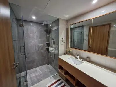 a bathroom with a shower and a sink and a tub at Laguna Residence, Pool View in Bang Tao Beach