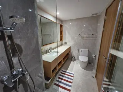 a bathroom with a shower and a sink and a toilet at Laguna Residence, Pool View in Bang Tao Beach
