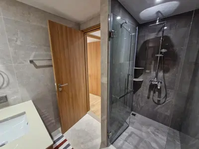 a bathroom with a shower with a glass door at Laguna Residence, Pool View in Bang Tao Beach