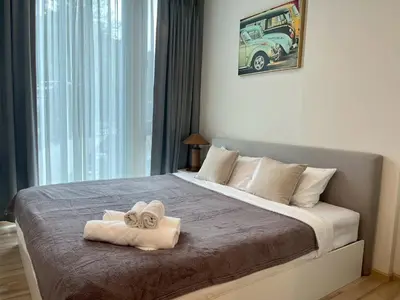 a bedroom with a large bed with towels on it at ห้องวิวเขา in Ban Ket Ho