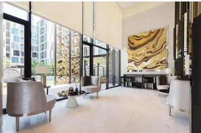 a lobby with chairs and a fireplace in a building at ห้องวิวเขา in Ban Ket Ho