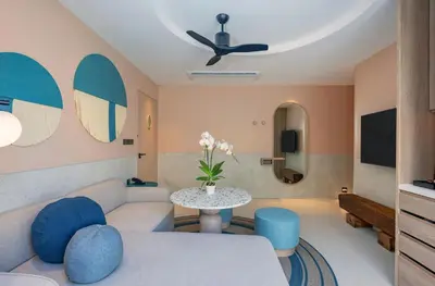 a living room with a couch and a table at Centara Karon Villas Phuket in Karon Beach