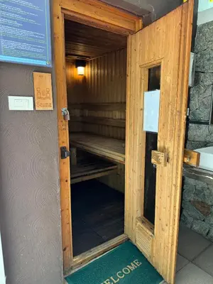 an open door to a sauna in a building at Pool Access Beachfront Studio in Phuket Town