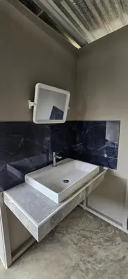 a bathroom with a sink and a mirror on the wall at Krabi Sea view, Lilly Beach Room Balibar in Krabi town