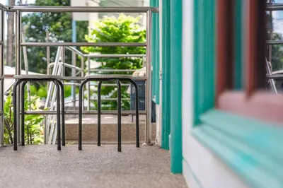 a group of chairs sitting on a balcony at The Coastal Haven Holiday Home, Karon Beach in Karon Beach