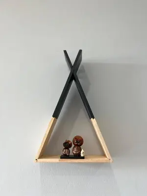 a wooden shelf with three objects on it at UPMOON Hotel Chalong Phuket in Ban Suan