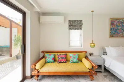 a living room with a couch and a bed at Villa Melita 5 bedrooms, hillside location with pool and seaview in Kata Beach