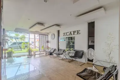 a living room with a table and chairs and a pool at C232 Prime spot Pool Gym Near Beach&Boat Ave in Bang Tao Beach