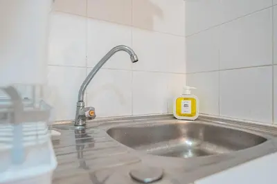 a bathroom sink with a soap bottle on it at Serenity Holiday Villa 2, Karon Beach in Karon Beach