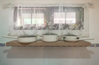 three pots and pans on a shelf in a kitchen at Serenity Holiday Villa 2, Karon Beach in Karon Beach