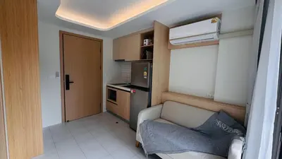 a small living room with a couch and a kitchen at Beautiful Sea 1BR apart A6 in Kamala Beach