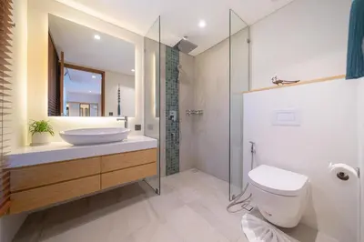 a bathroom with a sink and a toilet and a shower at Riverhouse Phuket - Private Pool Villas by Escape Villas in Laguna Phuket