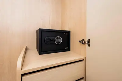 a television sitting on top of a cabinet at Modern 2BR apartment on Kamala Beach in Kamala Beach