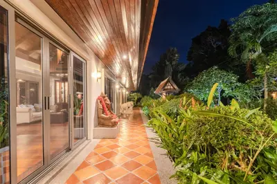 a hallway of a house with plants at V238 Villa 6BR Lakefront Jacuzzi Sauna & Gym, Near Beach in Rawai Beach