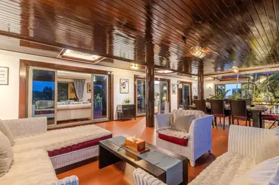 a living room with couches and a table at V238 Villa 6BR Lakefront Jacuzzi Sauna & Gym, Near Beach in Rawai Beach