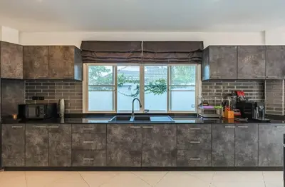 a kitchen with stainless steel cabinets and a sink at V161 Quiet 4BR with Pool Table, 3 Min to Rawai Beach in Rawai Beach