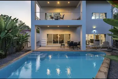 a house with a swimming pool in front of a house at V161 Quiet 4BR with Pool Table, 3 Min to Rawai Beach in Rawai Beach