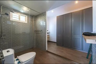 a bathroom with a toilet and a walk in shower at V161 Quiet 4BR with Pool Table, 3 Min to Rawai Beach in Rawai Beach