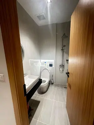 a bathroom with a toilet and a sink at MODERN NEW RELAX VILLA SoL & PooL in Nai Yang Beach