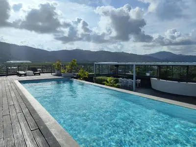 a swimming pool on the roof of a building at Chalong Bay - One bedroom on 7 Floor at Tower 1 in Ban Klang