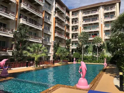 a swimming pool at a resort with pink flamingos at Phuket Villa Patong Pool-Garden View in Patong Beach